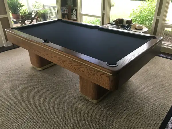 pool table refelting - new cloth stretched on bed and rails